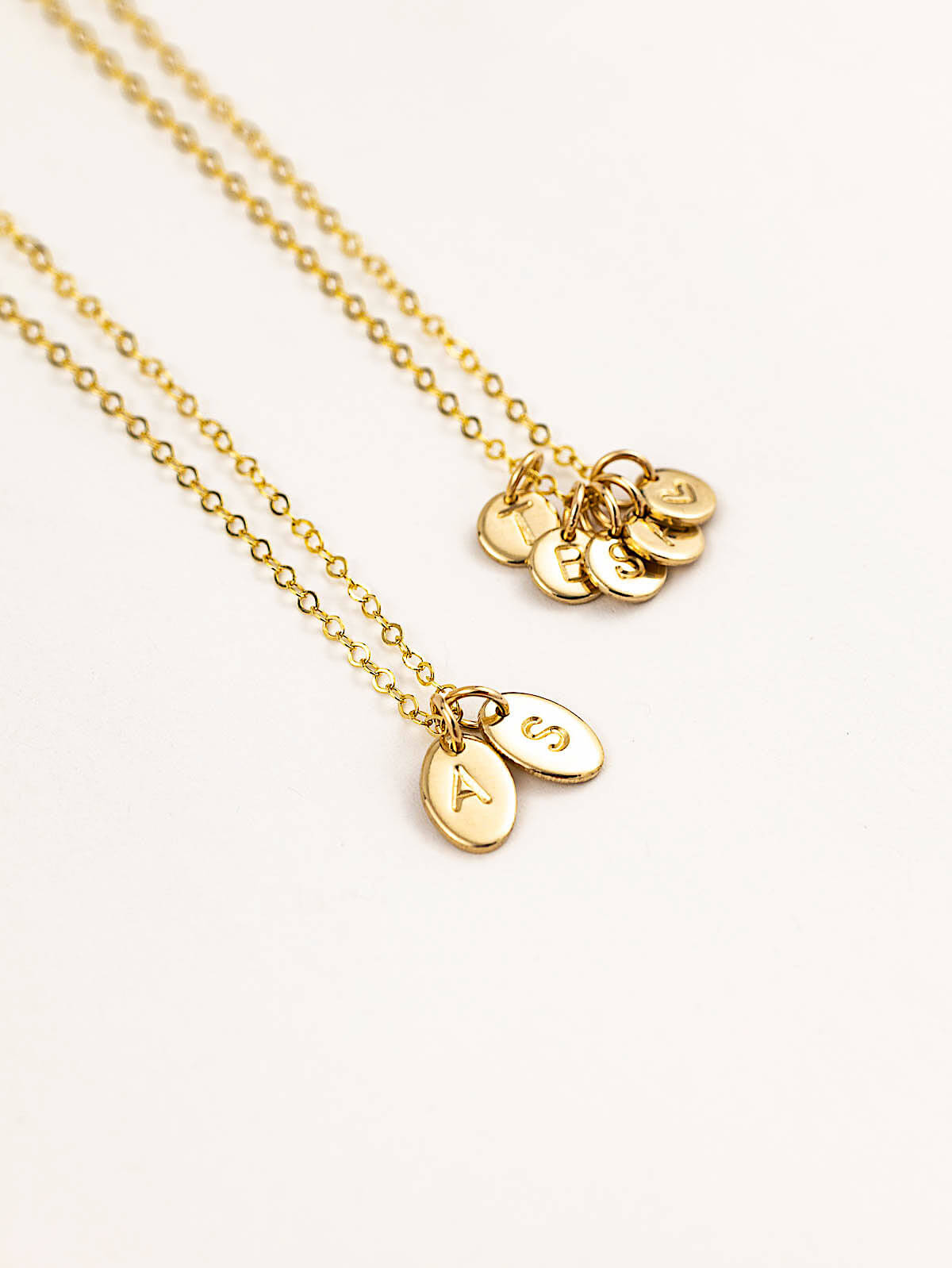 Oval letter pendants personalised