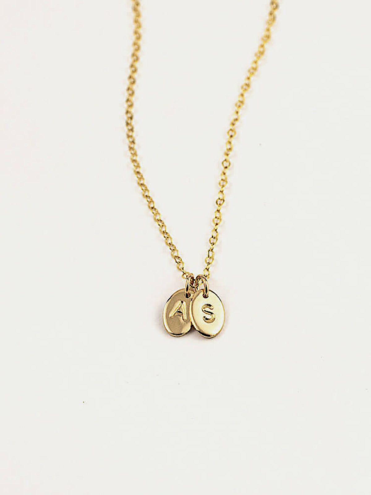 Oval letter pendants personalised