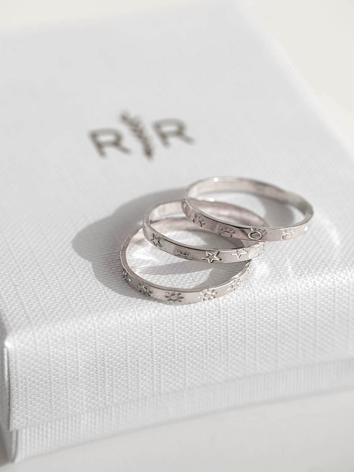 Infinity ring band with symbols sterling silver