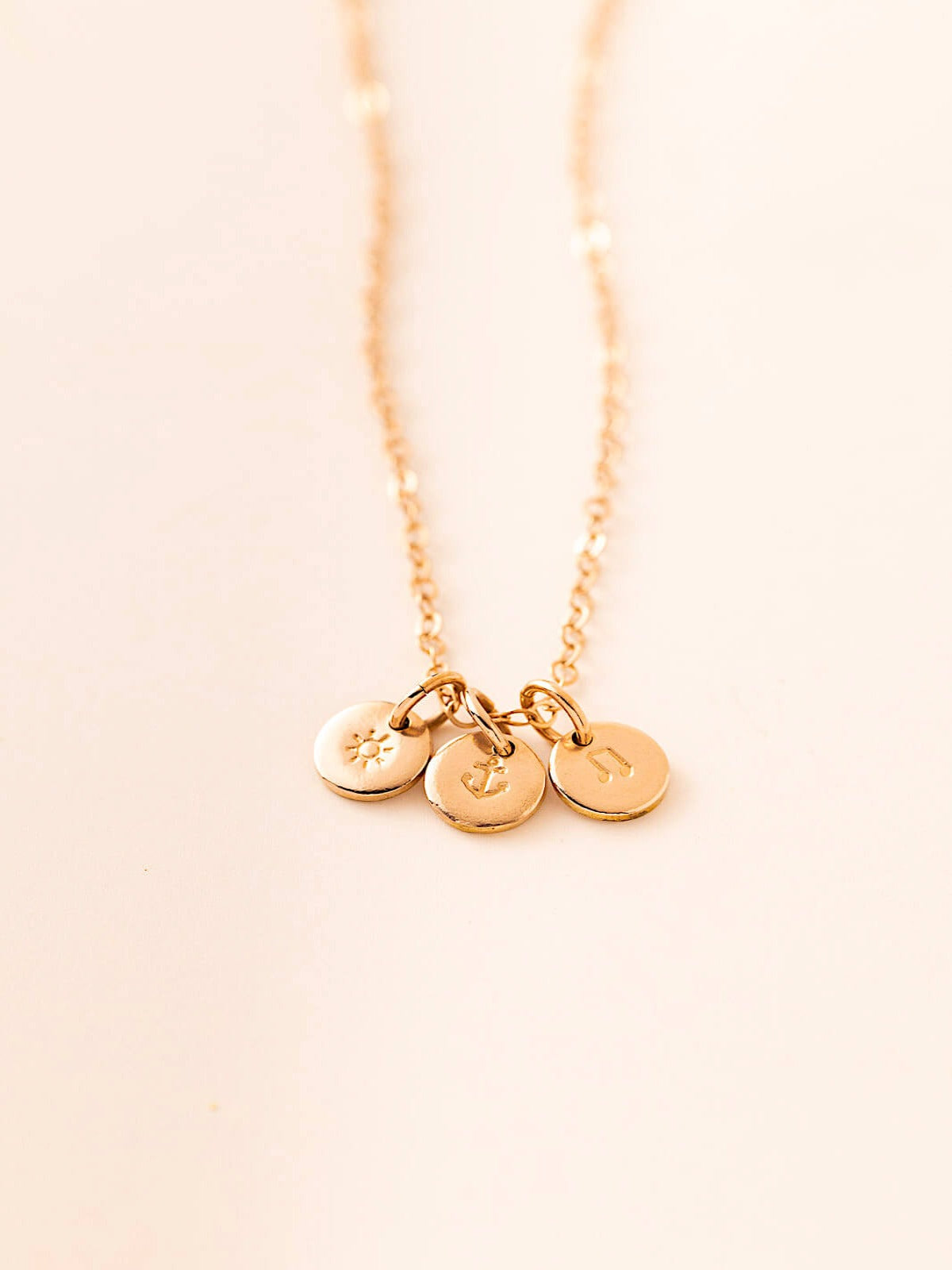 Symbols pendants in gold