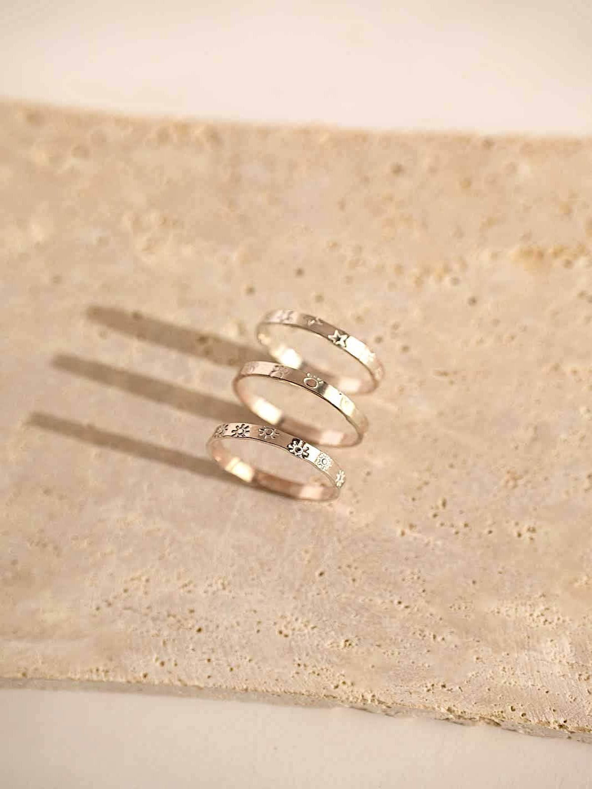 Infinity ring band with symbols sterling silver