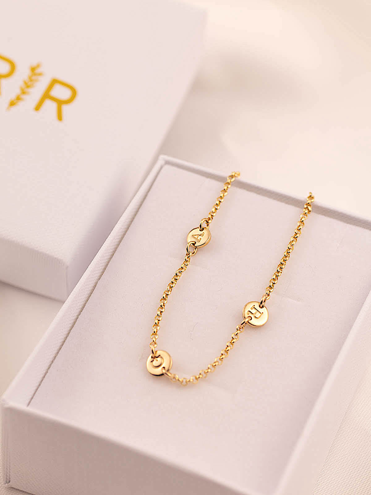runawayrosy letter bracelets in box