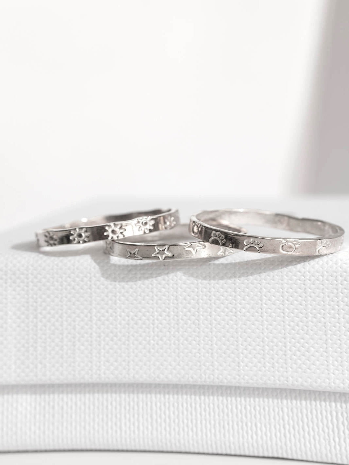 Infinity ring band with symbols sterling silver